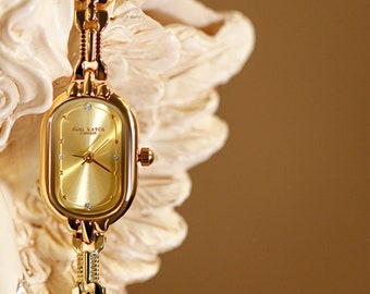 Petite montre montre dorée ovale
