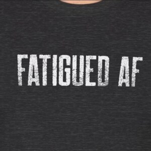 Fatigued AF Tshirt So Tired Funny Chronic Fatigue Syndrome black tee for Chronic Illness MECFS Tees with white lettering that says fatigued af