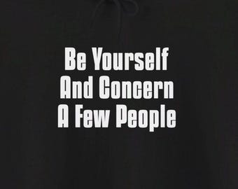May include: Black hoodie with white text that reads "Be Yourself And Concern A Few People".