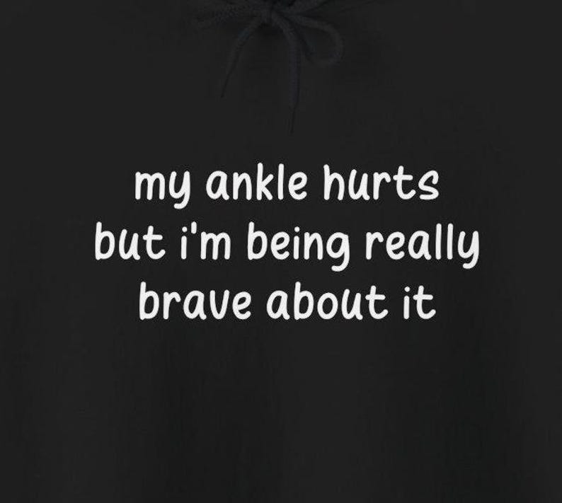 My Ankle Hurts But Im Being Really Brave About It hoodies Funny Injuries Sprains Twisted Broken Ankles Humor black hooded sweatshirts White Lettering