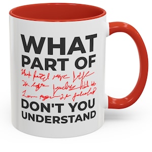 May include: White ceramic coffee mug with a red rim and handle. The mug has black text that reads "WHAT PART OF" with red handwritten text underneath that reads "What part of life do you agree jewelry add to love more 24/7 feeling?" and "DON'T YOU UNDERSTAND".