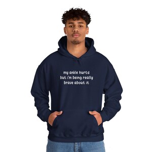 My Ankle Hurts But Im Being Really Brave About It hoodies Funny Injuries Sprains Twisted Broken Ankles Humor navy blue hooded sweatshirts White Lettering