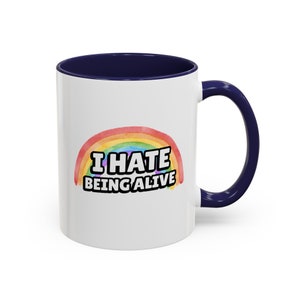 Funny Dark Humor 11 ounce ceramic mugs I Hate Being Alive Rainbow Snarky Sarcastic Tee with Depression Vibes white coffee mug with a rainbow and in white I hate being alive navy blue handle
