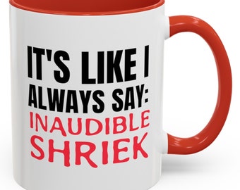 May include: White ceramic coffee mug with a red rim and handle. The mug has black text that reads "It's like I always say: INAUDIBLE SHRIEK" with the word "SHRIEK" in red.