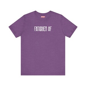 Fatigued AF Tshirt So Tired Funny Chronic Fatigue Syndrome purple tee for Chronic Illness MECFS Tees with white lettering that says fatigued af