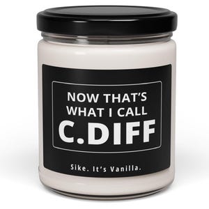 May include: A white candle in a glass jar with a black label that reads "Now that's what I call C.DIFF. Sike. It's Vanilla."