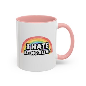 Funny Dark Humor 11 ounce ceramic mugs I Hate Being Alive Rainbow Snarky Sarcastic Tee with Depression Vibes white coffee mug with a rainbow and in white I hate being alive pink handle