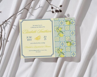May include: Wedding invitation with a lemon theme. The invitation has a cream-colored background with navy blue borders and text. The right side features a pattern of blue tiles with lemon illustrations. The text reads "Elizabeth Smithson" and the date.
