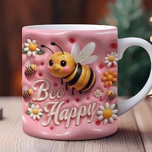 May include: Pink ceramic mug with a 3D bee design and the words "Bee Happy". The bee is yellow and black with a cute face and is surrounded by flowers.
