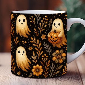 May include: White ceramic mug featuring a Halloween-themed design. The mug showcases a repeating pattern of friendly ghosts, pumpkins, and floral elements in gold and orange hues against a black background. The mug has a white handle.