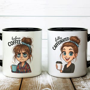 May include: Two white ceramic mugs with black handles and rims. One mug reads "before COFFEE" and features a cartoon woman with tired eyes. The other mug reads "fully CAFFEINATED" and shows a smiling woman with a coffee cup.