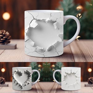 May include: White ceramic mug with a unique design featuring a cracked, textured surface. The design creates a visual effect of a hole or break in the mug's surface. The mug has a white handle and is set on a wooden surface.