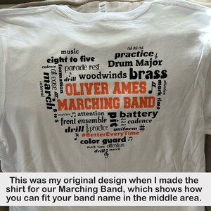 May include: White t-shirt with a black and orange word cloud design. The words include "music", "eight to five", "parade rest", "woodwinds", "brass", "OLIVER AMES", "MARCHING BAND", "practice", "Drum Major", "attention", "battery", "drill", "cadence", "uniform", "#BetterEveryTime", "color guard", "mark time", and "march".