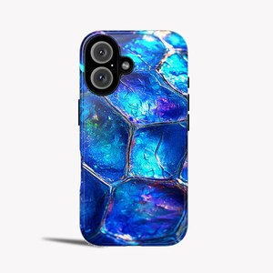 May include: A blue and purple iridescent phone case with a geometric pattern.