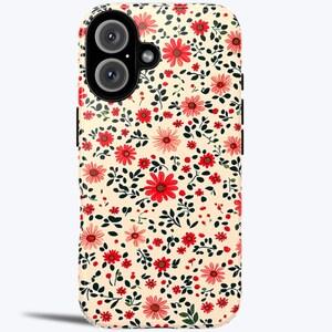 May include: A cream-colored phone case with a floral pattern featuring red and pink flowers and green leaves.