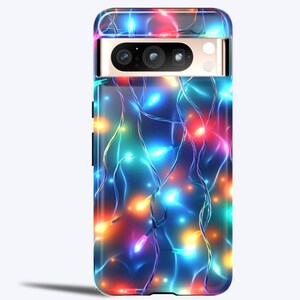 May include: A phone case with a colorful Christmas lights design. The case is black and has a cutout for the camera lens.