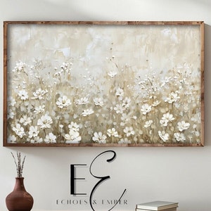 Könnte beinhalten: Ein gerahmtes Gemälde, das ein Feld mit weißen Blumen vor einem beigefarbenen Hintergrund zeigt. Die Blumen sind in einer strukturierten Art und Weise gemalt, was dem Gemälde einen dreidimensionalen Look verleiht.