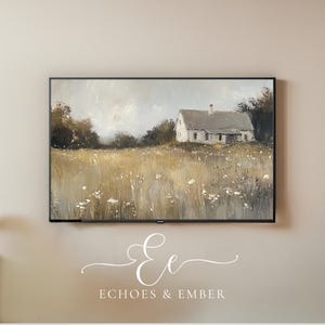 May include: A painting of a white farmhouse in a field of tall grass with a cloudy sky in the background. The painting is framed in a black frame.