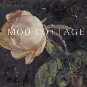 A white rose print on a black background with the words Mod Cottage.