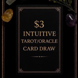 May include: A black card with gold text that reads "$3 Intuitive Tarot/Oracle Card Draw." The card is surrounded by decorative gold borders and is set against a black background. Accompanying the card are crystals and dried flowers.