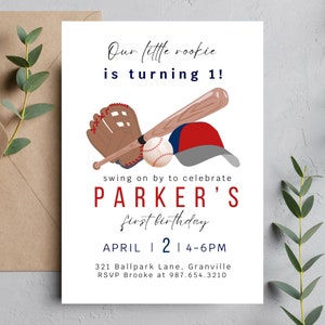 May include: Baseball-themed first birthday party invitation with a red, white, and blue baseball cap, glove, bat, and ball. The invitation reads "Our little rookie is turning 1!" and "Parker's first birthday". The date and time of the party are listed as "April 2 | 4-6PM". The address is "321 Ballpark Lane, Granville" and the RSVP information is "RSVP Brooke at 987.654.3210".