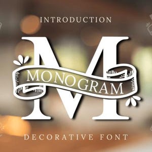 May include: A white letter M with a decorative banner that says "Monogram" in a vintage style font. The text "Introduction Decorative Font" is below the letter.