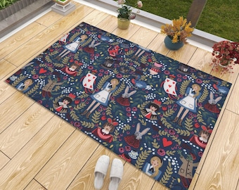 May include: A rectangular floor mat featuring a dark blue background with a repeating pattern of characters and motifs including a girl in a blue dress, rabbits, playing cards, top hats, teacups, red hearts, and green foliage throughout the design.