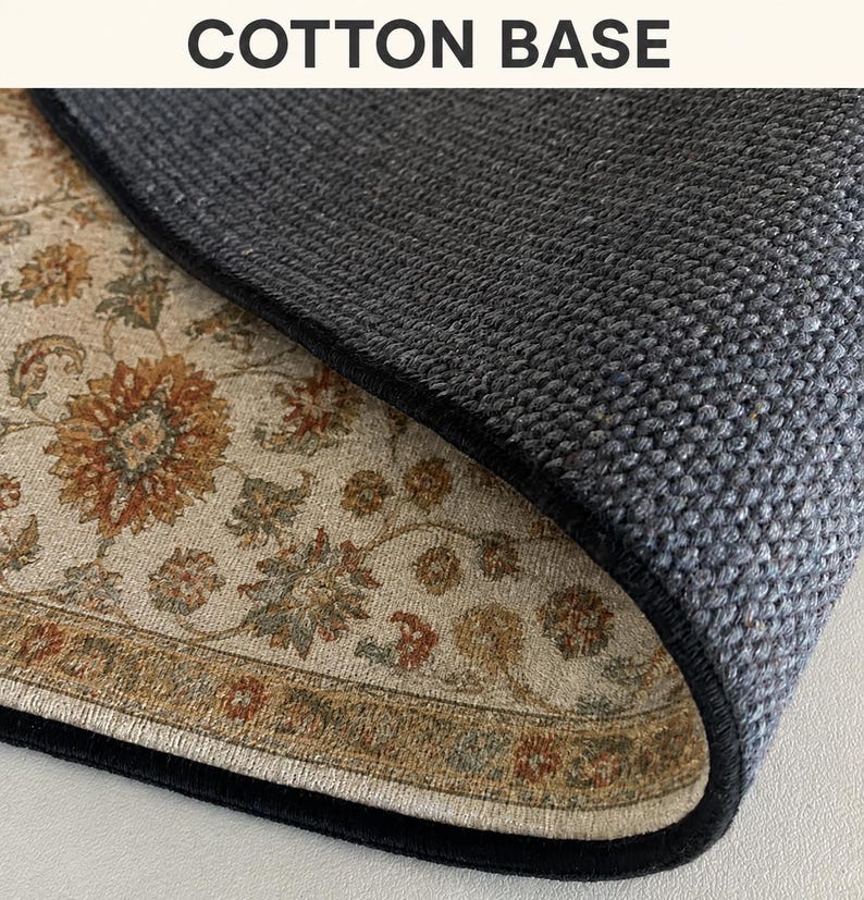 a close-up view of a textured rug or carpet with a floral pattern, resting on a surface.