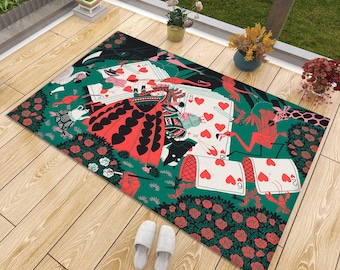 May include: A rectangular area rug featuring a vibrant illustration inspired by a deck of cards, including a queen figure in a red heart-patterned dress, playing cards with hearts, pink flamingos, a giraffe, and red roses on a dark green background.