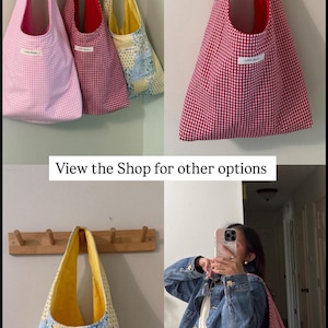 May include: A collection of tote bags in various patterns and colors. The bags include pink gingham, red gingham, and patchwork designs. The bags are hanging on a wooden rack. The text "View the Shop for other options" is visible.