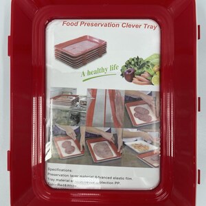 May include: A rectangular red and white food preservation tray featuring a clear plastic film cover. The packaging displays the text Food Preservation Clever Tray and A healthy life, along with images of food items and instructions for use.