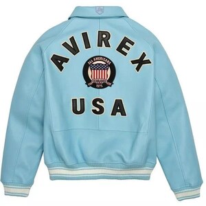 May include: A light blue leather jacket with the word "AVIREX" across the back in black block letters. Below the word "AVIREX" is a circular patch with the words "ALL AMERICANS ESTABLISHED 1975" and a graphic of the American flag. The word "USA" is below the patch.