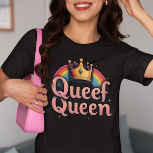 May include: Black t-shirt with a rainbow and a crown graphic. The text "Queef Queen" is written in pink letters.