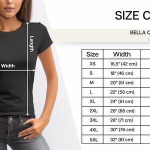 May include: Size chart for a Bella Canvas 3001 unisex t-shirt. The chart shows the width and length of the shirt in inches and centimeters for sizes XS to 5XL.
