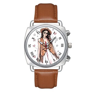May include: A wristwatch with a brown leather strap and a silver-toned square case. The white watch face features a central illustration of a person wearing a hat and vest, surrounded by Roman numerals, small pink hearts, and star icons.