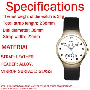 May include: A wristwatch with a gold-tone alloy case, a white dial featuring the text 'LOGO Custom Watch', and a black leather strap. Specifications include a 34g net weight, 238mm total strap length, 38mm dial diameter, and 22mm strap width.
