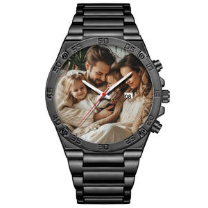 May include: A black metal wristwatch with a link band and a circular face featuring a custom photograph of a family. The watch dial displays white hour and minute hands, a thin red second hand, and a small date window showing the number 08.