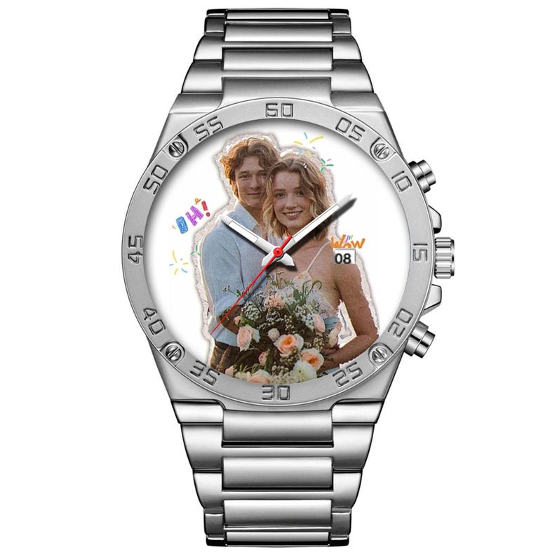 May include: A silver-toned stainless steel wristwatch with a metal link band. The watch face features a custom photograph of two people holding a floral bouquet, with the text OH! and confetti graphics. It includes a date window at the 3 o'clock position.