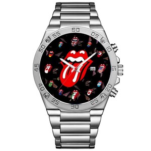 May include: A silver-tone stainless steel analog wristwatch with a black dial featuring a large red and white tongue logo in the center. Smaller tongue logos with various national flag patterns are scattered across the dial. It has a date window.