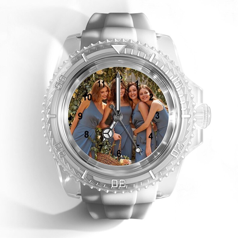 May include: A wristwatch with a translucent white silicone strap and a matching bezel. The watch face features a custom photograph of four people in blue dresses standing together, with black hour markers and silver hands indicating the time.