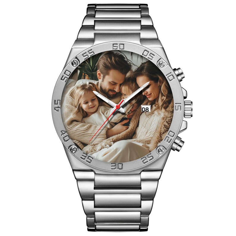 May include: A silver-tone analog wristwatch featuring a metal link band and a circular bezel with engraved minute markers. The watch face displays a custom photographic print of a family of four, with white hour and minute hands and a red second hand.