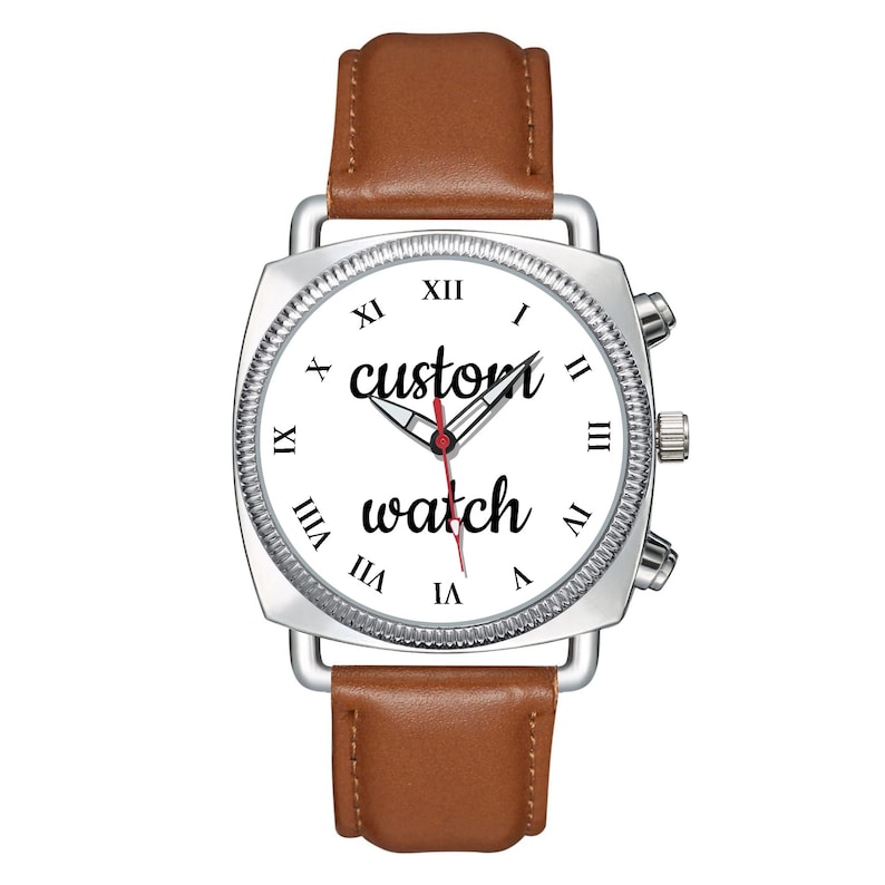 May include: A wristwatch with a silver square case, a white dial featuring black Roman numerals, and the text "custom watch" in black script. The watch has silver hour, minute, and red second hands, and a smooth brown leather strap.