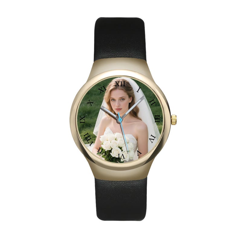 May include: A wristwatch with a gold-tone round case and a black leather strap. The watch face features a photographic print of a person in a white wedding dress holding a bouquet of white roses, with black Roman numerals marking the hours.