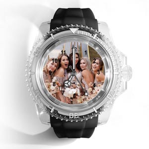 May include: A wristwatch featuring a clear, transparent casing and a black silicone strap. The watch face displays a photograph of four individuals in formal attire holding floral bouquets, with black hour markers and silver-toned hands.