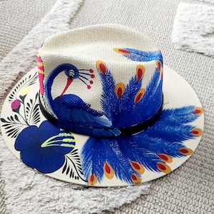 Beige sraw hat with blue peacock and flowers