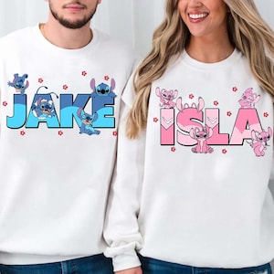 a man and a woman wearing matching sweatshirts