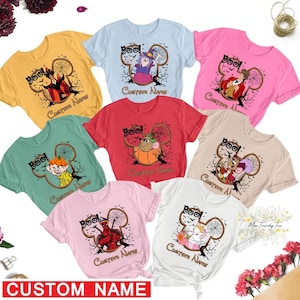 a group of t - shirts with cartoon characters on them