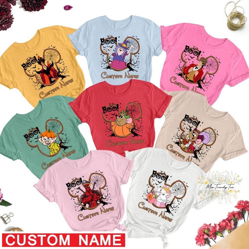 a group of t - shirts with cartoon characters on them