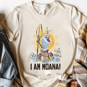 a t - shirt that says i am moan on it