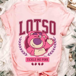 a pink t - shirt with the words lotus on it